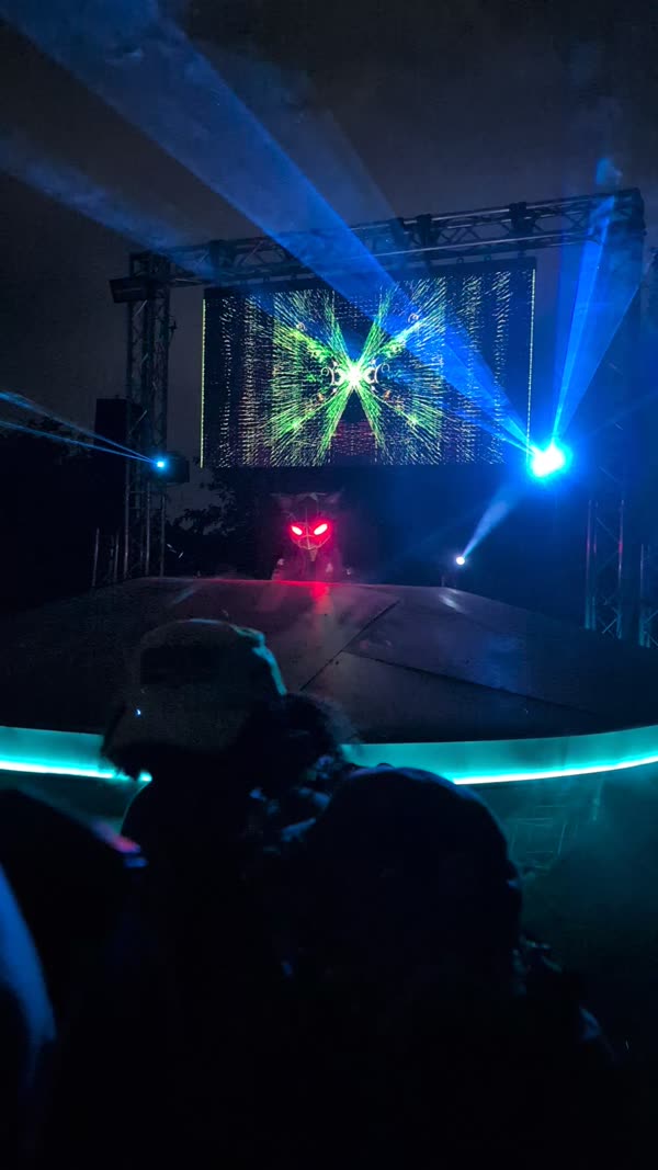 Round stage with LED edge lighting and blue beams